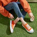 Women's low-top sneakers with lace-up closure